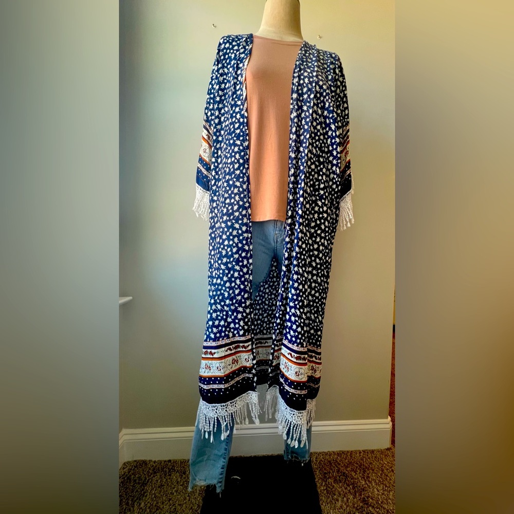 Brand New With Tags Floral Kimono is super cute and bohemian style. One size